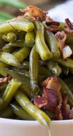 green beans with bacon in a white bowl