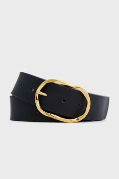 Founded on the belief that belts can instantly elevate an outfit, B-Low the Belt creates pieces that are functional, fashion-forward, and always coveted.The Black Kyra Belt is an essential addition to your year-round closet. With cowhide black leather and a gold-toned polished buckle, this can serve as a classy detail for any outfit. Wear with a button-down and french tuck for an sophisticated statement, with a dress or blazer to cinch the waist, or with a body suit and skirt for a touch of elegance. 
Adjustable length
5 holes
Gold-tone oval buckle closure
Material: Italian Cowhide Leather (belt), Nubuck Leather (lining), Italian Hardware (buckle)
Made in USA Suit And Skirt, Round Closet, French Tuck, Thick Belt, B Low The Belt, Functional Fashion, Plus And Minus, Nubuck Leather, Body Suit