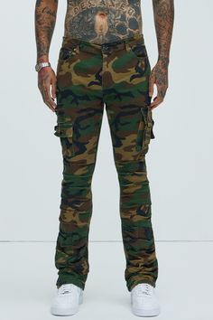 Available In Camouflage. Flared Fit Zip Fly Button Closure 5 Pocket Detail Cargo Pockets With Strap Detail Ruched Detail 98% Cotton 2% Spandex Imported | Mens Step In Ruched Slim Flare Cargo Pants in Camouflage size 42 by Fashion Nova Military Camouflage Cargo Jeans, Military Cargo Style Camouflage Jeans, Camouflage Military Cargo Jeans, Stretch Military Camouflage Bottoms, Fitted Combat Bottoms With Cargo Pockets, Fitted Camouflage Bottoms With Cargo Pockets, Fitted Camouflage Cargo Pants, Fitted Camouflage Pants With Cargo Pockets, Fitted Camouflage Military Pants