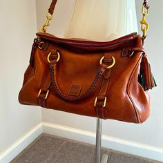 Beautiful Dooney & Bourke Leather Satchel. No Rips, Tears Punctures Or Physical Damage, Just Minor Signs Of Wear On The Leather. Excellent Condition. Leather Suede Removable/Adjustable Strap Dooney & Bourke Bags, Leather Satchel, Dooney Bourke, Tan Brown, Satchel, Adjustable Straps, Bag Lady, Signs, Leather