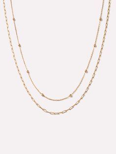 Effortlessly elevate every look with this layered necklace set. Crafted in waterproof and tarnish-free solid gold, this timeless set features two dainty necklaces - a satellite chain and a paperclip chain. This truly unique pair adds something eye-catching to every neckline. Complete your look with our Gold Bead Studs for a fun and femme look. The Layered Necklace includes two pieces: Dainty Gold Necklace - Gold Satellite Necklace and Gold Paperclip Chain Necklace - Gold Paperclip Necklace. • Crafted in 100% recycled, waterproof solid gold • Necklace set featuring two different chain patterns • Tarnish-free & made to last a lifetime Satellite Necklace, Gold Paperclip Necklace, Gold Layered Necklace, Paperclip Necklace, Dainty Necklaces, Layered Necklace Set, Solid Gold Necklace, Dainty Gold Necklace, Gold Necklace Set