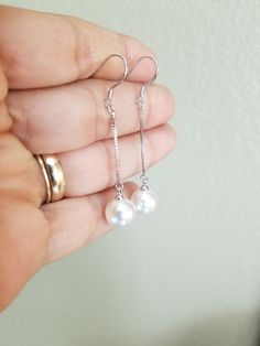 Style: Dangle earrings. Dainty Metal Drop Pearl Earrings, White Metal Dangle Linear Earrings, Hypoallergenic Metal Dangle Pearl Earrings, Hypoallergenic Dangle Pearl Earrings, Silver Pearl Drop Threader Earrings, Pearl Drop Dangle Linear Earrings, Dainty Dangle Linear Earrings For Formal Occasions, Dainty Linear Dangle Earrings For Formal Occasions, Classic Nickel-free Linear Drop Earrings