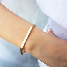 The Gold Minimalist Cuff Bracelet brings a classic style to your everyday piece. With a polished finish, this skinny bracelet is 14K gold filled. You can wear this piece on its own or stack it with other HLcollection bracelets. PRODUCT DETAILS: 4 mm wide bracelet. Open cuff - will fit most wrists MATERIALS: 14K Gold Filled 14K Gold Filled jewelry is not the same as gold-plated jewelry. It contains 5% of solid gold and is done by a process of heat bonding. The layer of gold is permanently bonded Adjustable Matte Gold Minimalist Bracelet, Sleek Everyday Bangle Bracelets, Sleek Everyday Bangle Bracelet, Minimalist 14k Gold Cuff Bracelet Gift, Minimalist Cuff Bangle Bracelet, Simple Everyday Cuff Bracelet Bangle, Minimalist Everyday Rose Gold Cuff Bracelet, Minimalist Gold Bangle Cuff Bracelet, Adjustable Minimalist 14k Gold Bangle