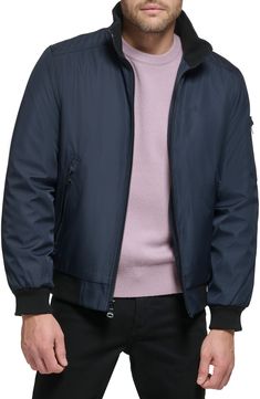 Every closet craves this edgy bomber styled with handy side pockets, a water-resistant finish and comfy ribbed trim. Front zip closure Stand collar Front zip pockets Ribbed cuffs and hem Water resistant Lined 100% polyester Machine wash, line dry Imported Casual Nylon Windbreaker With Zip Fly, Fall Nylon Windbreaker With Zip Fly, Modern Nylon Outerwear With Ribbed Cuffs, Fall Nylon Outerwear With Side Pockets, Casual Windbreaker With Ykk Zipper, Casual Solid Outerwear With Ribbed Collar, Casual Outerwear With Ribbed Collar, Modern Nylon Outerwear With Pockets, Sporty Solid Outerwear With Ribbed Collar