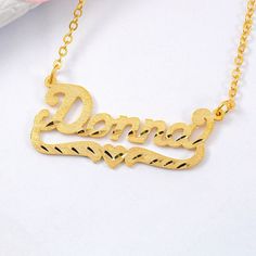 Material: Copper, 925 Sterling Silver. Color: Gold. Process: Gold plated.  Chain Length: 14",16",18",20",22".  Recipient: Women, Mom, Wife, Girl Friend, Children.  Product Type: Personalized Jewelry.  Gift Type: Necklace.  Occasions: Valentine's Day, Mother's Day, Christmas, Birthday, etc.  Necklace Type: Necklace.  Brand: Silviax Jewelry. Customized Gold Heart Necklace For Mother's Day, Gold Nameplate Heart Necklace For Mother's Day, Gold Custom Name Heart Necklace For Mother's Day, Gold Engraved Heart Necklace For Birthday, Gold Heart Necklace With Name For Mother's Day, Customizable Gold Heart Necklace In Sterling Silver, Mother's Day Gold Heart Necklace With Custom Name, Gold Nameplate Charm Necklace For Valentine's Day, Gold Name Necklace For Valentine's Day