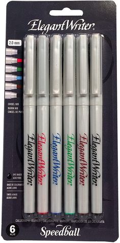 four white markers with red and green writing on them are in the package for sale