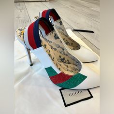 This Is An Authentic Pair Of Gucci Calfskin Glitter High Heel Slingback Pumps In White. These Bold Pumps Are Crafted Of Smooth Calfskin Leather In White With Green And Red Stripes. They Feature Red, White, And Blue Striped Ankle Straps And A 4 Inch Heel. Glitter High Heels, White Pumps, 4 Inch Heels, Green And Red, Slingback Pump, Gucci Shoes, Ankle Straps, Red White And Blue, Shoes Women Heels