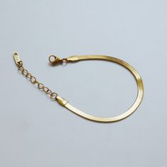 "Check out the matching necklace here: https://www.etsy.com/listing/773115968 --------------------------------------------------------------- Brand new. Selling one piece of gold snake chain bracelet. Instagram style. The bracelet has an extension. The length should fit most people. You may wear it with other jewelry. Material: 18k gold plated titanium Total length: 6\" / 15.5cm plus 1.7\" / 4.5cm extension Bracelet width: 4mm Q&A 1. What is the material? - It is made from 18K real gold plat Flat Snake Chain, Butterfly Anklet, Gold Snake Chain, Herringbone Chain, Bracelet Minimalist, Minimalist Women, Snake Chain Bracelets, Instagram Style, Gold Snake