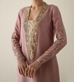 Product Description:  Presenting our long shirt made of pure raw silk in a coral blush color--a subtle yet elegant vision. This blouse, has tiki stones, crystals, dabka, naqshi, and Kamdani handwork embellishing the sleeves and collar. This ensemble is the pinnacle of sophistication and elegance, paired with an organza dupatta with sequence edging and a hizar embellished with intricate sequence stitching. Color: Coral Can be customized in any color Includes:  Shirt Pants Duppata Novel Books, Painting Scenery, Books Wedding, Shorts Crochet, Aesthetic Shorts, Music Painting, Silk Outfit, Embroidery Suits Design, Organza Dupatta