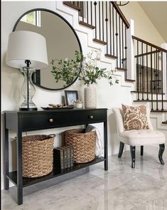 a living room with a mirror and some baskets