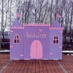 a pink and purple princess castle made out of cardboard