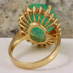 13.00 Carats Natural Emerald and Diamond 14K Solid Yellow Gold Ring Suggested Replacement Value: $13,000.00 Total Natural Green Emerald Weight is: 12.00 Carats (transparent) Emerald Measures: 16.27 x 14.42mm Natural Round Diamonds Weight: 1.00 Carats (color G / Clarity VS2-SI1) Ring total weight: 8.8 grams Disclaimer: all weights, measurements and colors are approximate and may vary slightly from the listed dimensions or as seen in the image. All pictures are magnified to show the smallest of de Strange Rings, Emerald Gem, Etsy Gold Ring, Lovely Ring, Ring Photos, Emerald Gemstone, Green Emerald, Yellow Gold Ring, Natural Emerald