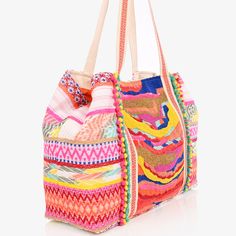 The Isabella Adorned Tote is a beautifully crafted, woven bag in a kaleidoscope of colors - including yellow, pink, blue, and gold. It showcases intricate, hand-embellished needlework and beading, with playful mini pompom accents for the perfect finishing touch. Magnetic Button Closure Lined Interiors with Zip Pocket and Mobile Pocket Size 24" X 13" X 6" Bohemian Embellished Bag For Vacation, Bohemian Embellished Bags For Vacation, Spring Bohemian Beaded Bags, Multicolor Beaded Shoulder Bag, Bohemian Multicolor Fabric Bag, Bohemian Multicolor Fabric Shoulder Bag, Multicolor Bohemian Fabric Shoulder Bag, Multicolor Embroidered Shoulder Bag With Tassels, Embellished Multicolor Summer Shoulder Bag