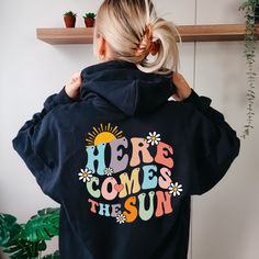 Here Comes The Sun Text Hoodie, Aesthetic Gift for Womens, Oversized Hoodie, Beach Hoodie for Girls, Positive Hoodie, Trendy Summer Hoodie 👉HOW TO ORDER👈 1️⃣  Choose your T-shirt color 2️⃣  Choose your T-Shirt size 3️⃣  Choose your design & text color 4️⃣ Need more Items? Add the current item in the cart. And If you like to add more items to your order please press the back button and repeat steps 1-3 again. 5️⃣Once all your desired items are in your cart you may complete your order by enterin Vsco Style Long Sleeve Hoodie With Letter Print, Winter Vsco Hoodie With Letter Print, Oversized Long Sleeve Vsco Hoodie, Cotton Vsco Hoodie With Graphic Print, Cotton Graphic Print Vsco Hoodie, Fun Graphic Print Hoodie For Spring, Fun Hoodie Sweatshirt With Drawstring Hood, Fun Sweatshirt With Drawstring Hood, Fun Cotton Hoodie