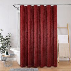 a red shower curtain in a bathroom