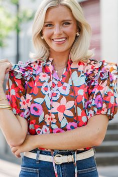 This floral blouse is such a must have! That print is super bold and fun! Plus, we love that ruffled detailing along the shoulders! V-neckline Short bubble sleeves Ruffled detailing Floral print No stretch Payton is wearing the small. Patterned Floral Print V-neck Blouse, Floral Print Flutter Sleeve Blouse For Brunch, Floral Print Blouse With Flutter Sleeves For Brunch, Flutter Sleeve Blouse With Floral Print For Brunch, Fitted Blouse With Floral Print And Ruffle Sleeves, Spring Printed Ruffle Sleeve Blouse, Spring Printed Blouse With Ruffle Sleeves, Fitted Printed Blouse With Ruffle Sleeves, Printed Fitted Blouse With Ruffle Sleeves