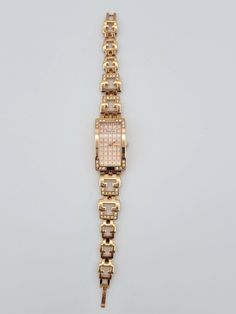 "Alias Kim Rose Gold Tone Rectangle Ladies Watch with Bracelet Band & Rhinestones  This shining watch makes a beautiful everyday piece.  The rose gold-tone watch is rectangular in shape has rhinestone accents in the corner.  The face of the watch has a plaid rose gold-tone & glitter pattern with rose gold-tone hands.  The openwork bracelet band is accented with rhinestones & has a snap lock clasp.  This watch is in excellent condition with very little wear.  A NEW battery was inserted in November 2023 & the watch works perfectly.   Dimensions: Band: 7 1/4\" long; Case: 21 x 36 mm Clasp: Snap Lock Markings: Alias Kim Condition: Excellent - very little wear, new battery All of my shop items are pre-owned vintage.  All pieces should be expected to have some vintage wear unless otherwise state Rectangular Gold Diamond Watch, Rose Gold Rectangular Jewelry With Bracelet Strap, Rose Gold Rectangular Bracelet Jewelry, Jewelry Closet, Rhinestone Costumes, Glitter Pattern, Snap Lock, Jewelry Women, Ladies Watch