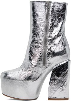 Ankle-high grained leather boots in metallic silver-tone. · Zip closure at inner side · Leather lining · Covered platform midsole · Covered block heel with rubber injection · Leather sole · Platform: H2.25 in · Heel: H5 in Supplier color: Silver Silver Platform Boots, Modern Platform Boots With Reinforced Heel For Party, Modern Chunky Platform Boots For Party, Glamorous Platform Ankle Boots, Silver Heeled Boots With Reinforced Heel For Party, Silver High Heel Platform Boots, Silver High Heel Platform Boots For Party, Glamorous High Ankle Platform Boots, Glamorous Metallic Boots