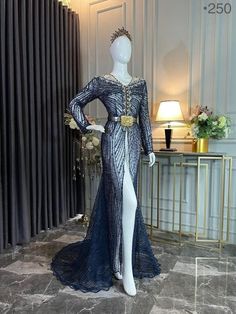 a mannequin dressed in a blue evening gown