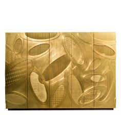 a large metal wall sculpture with many different shapes and sizes on it's sides