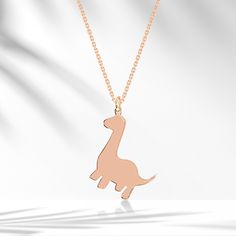 ❤️🦕14K Solid Gold  Dino Minimalist Necklace 🦕❤️ 🦕 Cute Dino Apatosaurus Necklace 🦕  Dinosaurs may be extinct from the face of the planet, but they are alive and well in our imaginations.❤️ Details of the Product. Weight: Approximately 1,63g Cute minimalist Necklace. - All of our products are handmade produced of 8K, 14K, 18K real gold. The certificates of the diamonds we use in our products will be delivered by the cargo together with your orders. - Make sure you choose the right size and color before completing your order. If there is a preference you want to change, please contact us via message before your order is shipped. - All of our products are delivered to cargo within 1-6 working days. - Comes in a fancy jewelry box. - Your orders are under the responsibility of Venta Jewelry Cute Dino, Baby Necklace, Necklace Cute, Fancy Jewelry, Minimalist Necklace, Real Gold, Charm Necklace, The Face, Solid Gold