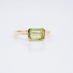 Emerald Shape Peridot Ring, 14k Yellow Gold Plated Ring, Handmade Ring, Women's Statement Ring, Beautiful Peridot Stone Ring, Gift For Her  Discover the captivating allure of this exquisite 925 Solid Sterling Silver Peridot Ring. The stunning green Peridot gemstone's emerald cut exudes natural beauty. This handcrafted ring exudes luxury and sophistication with its extravagant 14k Rose Gold Fill accent. With this luxurious item that expertly combines grace and fashion, embrace a remarkable appear Classic Green Amethyst Ring As Gift, Classic Green Amethyst Ring For Gift, Classic Green Amethyst Ring Gift, Green Amethyst Ring In 14k Gold, Green Diamond Ring In 14k Gold, Green 14k Gold Ring With Prong Setting, Emerald Cut Green Stackable Rings In 14k Gold, Emerald Cut Peridot Ring For May Birthstone, Yellow Gold Peridot Diamond Ring With Birthstone