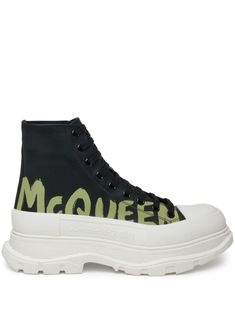 black/white calf leather round toe rubber toecap embossed detail signature Graffiti print to the side logo-print tongue branded heel counter ankle-length branded leather insole chunky rubber sole front lace-up fastening To lessen the environmental impact and to reduce cotton consumption, Alexander McQueen will no longer be providing a dust bag with its sneakers. We've partnered with Good On You — an independent agency that rates how brands perform in relation to their impact on the planet, peopl Alexander Mcqueen Tread Slick, Balenciaga Track, Graffiti Prints, Chunky Sneakers, Derby Shoes, Designer Boots, Espadrille Shoes, Environmental Impact, Party Shoes