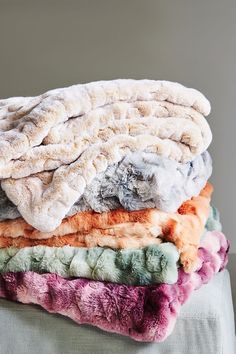 several blankets stacked on top of each other