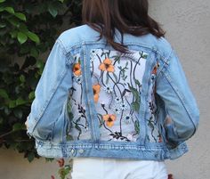 Unique denim jacket with beautiful, orange and blue poppy lace. It is unique, so be prepared for people to stop and ask where you got it. This jacket is perfect for a night out at a concert, coffee with friends, or it can be a great gift for your wife, friend, sister or mom. The jacket has lace on the middle back and front, bottom back and front or you can step it up by adding lace to the full back and front. The jacket is machine washable on gentle cycle, cold, hang to dry. It's perfect for whatever size you are with sizes  S=(4-6), M=(8-10), L=(12-14), XL=(16-18), XXL(20-22), 3X =(24-26). Check the pictures for exact measurements for each size. Embroidered White Denim Jacket For Spring, Floral Print Denim Jacket For Summer, White Embroidered Denim Jacket For Spring, Fitted Floral Print Denim Jacket, Fitted Denim Jacket With Floral Embroidery For Summer, Spring Blue Denim Jacket With Floral Print, Fitted Denim Jacket With Floral Print, Unique Denim Jacket, Mom Friend