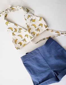 "Girls crop Banana Print Halter Top, 70s inspired girls shirt, boho beach outfit ❤Listing is for the top only This halter top is made in an off-white cotton poplin featuring yellow bananas outlined in black. 1970s inspired! Pair it with flares or high waisted shorts to get that cute 70s look ❤Complete the outfit with matching highwaisted shorts, available here: https://www.etsy.com/shop/CeciliaAndMae?ref=simple-shop-header-name&listing_id=654125713&section_id=26035288 Size chart: 3T Ches Sleeveless Cotton Tops For Beach Party, Summer Fitted Crop Top For Picnic, Triangle Top For Summer Day Out, Fitted Summer Crop Top For Picnic, Fitted Crop Top For Summer Picnic, Summer Triangle Top Crop Top For Day Out, Summer Triangle Crop Top For Day Out, Retro Cotton Summer Tops, Retro Cotton Tops For Summer