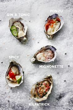 six oysters with different toppings on them sitting in the snow, labeled as spicy, mimosette, kilpatrick, gin & tonic