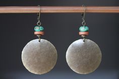 "These boho dangle earrings are made with antique brass discs that I hammered first, then to give more texture and character, I domed them. I added some brown earthy ceramic discs and some blue green brownish African turquoise beads on the top.  Color :  Blue green African turquoise stones Finish : Antiqued Brass disc round hammered and hand domed by myself  1\"1/4 ( 32 mm)  Size : 2\" 1/4 including the antiqued brass lever back For more choices on my brass boho earrings, please refer to the link below : https://www.etsy.com/shop/NtikArtJewelry?section_id=16059931 I usually ship between 1 and 3 business day with USPS. If you need an order sooner you can still select a priority mail at direct check out. I will do my best to send them out ASAP. I always ship in eco - friendly packages. Your Handmade Bohemian Round Disc Jewelry, Handmade Bohemian Disc Jewelry, Bohemian Handmade Round Disc Jewelry, Nickel-free Brass Earthy Earrings, Earthy Nickel-free Brass Earrings, Bohemian Festival Earrings With Patina, Bohemian Patina Earrings, Bohemian Nickel-free Round Disc Jewelry, Earthy Ceramics