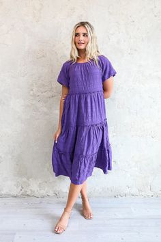 Casual Solid Color Tiered Dress, Relaxed Fit Midi Dress With Ruffles, Casual Tiered Ruffle Midi Dress, Modest Flowy Tiered Dress, Casual Midi Length Tiered Ruffle Dress, Casual Tiered Midi Dress With Ruffles, Purple Short Sleeve Midi Dress With Ruffles, Purple Midi Dress With Short Sleeves And Ruffles, Casual Solid Color Tiered Midi Dress