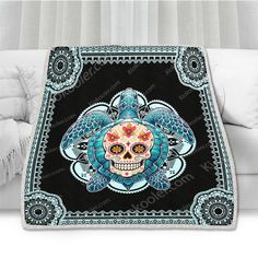 a blanket with a skull on it in the shape of a flower and ornate design