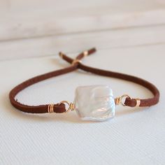 "Perfect in its simplicity. A single square pearl with soft, genuine suede leather. Sliding coiled bead for closure. Available in sterling silver, 14k gold fill and rose gold fill. Two sizes. 5\" too 8\" and 7\" to 10\". I use only the finest quality materials to make my pieces. Each stone is carefully selected and I never use plated materials. All chains, wires and findings are sterling silver or 14k gold fill. I guarantee all of my work, including materials as well as the craftsmanship. I will Sundance Jewelry, Suede Bracelet, Boho Choker, Handmade Jewel, Wire Work Jewelry, Work Jewelry, Handmade Jewelry Diy, Layered Jewelry, Stone Gold