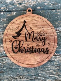 a wooden ornament with the words merry christmas on it