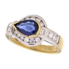 Ring made of 18kt yellow gold with drop-cut blue sapphire for ct .1.16 and natural white brilliant-cut diamonds for ct.0.68 Welcome to our jewelry collection, where every piece tells a story of timeless elegance and unparalleled craftsmanship. As a family-run business in Italy for over 100 years, we pride ourselves on creating exceptional jewelry that is not only beautiful, but also embodies the rich history and culture of our country. We understand that purchasing jewelry is an investment, whic Yellow Gold Pear-shaped Sapphire Ring, Jewelry Business, White Diamonds, Brilliant Cut Diamond, Cocktail Rings, 100 Years, Diamond White, Precious Metals, Blue Sapphire