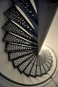 a spiral metal object on top of a white table