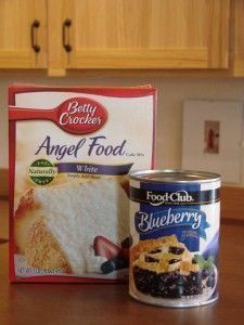 a can of angel food cake next to a box of angel food blueberry cake