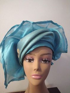 African Gele Head wrap is a must have for any woman who wants to add a touch of elegance and sophistication to her wardrobe. It's a unique style is perfect for those who wants to stand out in the crowd. The head wrap is suitable for the mother of the bride, mother of the groom, church ladies, pastors wife, pastors, tea parties and weddings.It is perfect for a queen and it's sure to make you feel like royalty Spring Party Headwrap One Size, Elegant One Size Wraps For Spring, Adjustable Party Turban, Elegant Adjustable Blue Headwrap, Elegant Blue Headscarf, Evening Fitted Turban, Spring Party Headwrap - One Size Fits Most, Elegant Fitted Summer Headwrap, Elegant Fitted Summer Turban