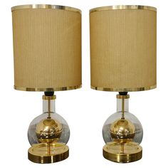 two clear and gold glass table lamps with shades