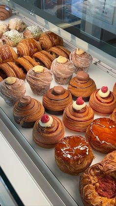 a display case filled with lots of different types of pastries