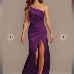 a woman in a long purple dress with one leg slited up and the other side split