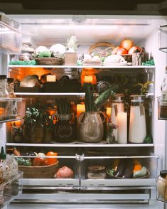 an open refrigerator filled with lots of food