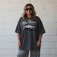 This WOMEN'S oversized tee will be your new weekly staple. Trust us :) - 100% COTTON - Washed grey/light black color tee - Off white and black design with a pop of orange - Super slouchy, and comfy -VERY oversized fit so please review size chart below -S/M is equivalent to unisex XL -L/XL is equivalent to unisex 3XL -Model 1 is wearing the L/XL and Model 2 is wearing the S/M. -Graphic by Ash Ulmer of Ash Ulmer Design. CARE INSTRUCTIONS: Wash inside out in cold water, gentle cycle + air dry. WILL Shorts Romper Outfit, Womens Oversized Tee, White And Black Design, Romper Outfit, Grey Light, Light Black, Pajama Top, Swimsuit Cover, Oversized Tee