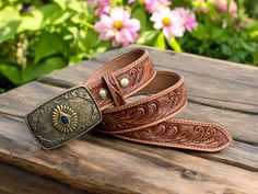 Tooled western leather belt for men cowboy style with blue stone western buckle Snap on system allows for interchanging buckles Fully handmade western leather belt hand crafted out of a single piece full grain genuine cowhide leather ABOUT THE PRODUCT: ➤High quality brass and stone buckle. ➤100% full grain genuine leather. ➤Personalized western cowboy leather belt ➤Custom engraving option. ➤ Easy Snap System for Interchanging Buckles ➤Returns from 30 days of receiving, no returns for personalize Western Antique Belt Buckles In Rectangular Shape, Western Antique Rectangular Belt Buckle, Western Style Rectangular Antique Belt Buckle, Western Belts And Suspenders With Antique Buckle, Western Belts And Suspenders With Antique Buckle For Ranch, Western Style Belts And Suspenders With Concho, Western Style Adjustable Belts And Suspenders With Concho, Western Belts And Suspenders For Rodeo, Western Style Belts And Suspenders For Rodeo