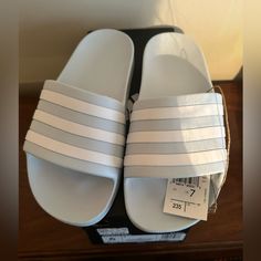 New In Box Women's Adidas Adilette Aqua Slides Sandal Size 7 Light Blue & White Adidas Blue Sandals For Spring, Spring Blue Adidas Sandals, Adidas Blue Slip-on Sandals, Adidas Blue Synthetic Sandals, Adidas Blue Slides For Beach, Blue Adidas Slides For Beach, Blue Adidas Slides For The Beach, Adidas Blue Open Toe Sandals, Blue Adidas Synthetic Slides