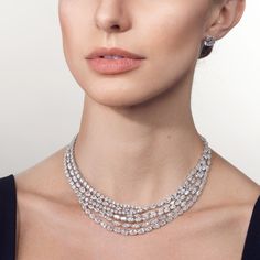 A covetable jewel with a larger than life shine, this multi-layered diamond necklace offers an allure that cascades gracefully across the neckline. Its multiple rows of diamonds in different cuts provide a full-coverage sparkle. Showcasing X carats of diamonds, indulge in a showstopping piece that will enduringly stand out and leave a lasting impression. Luxury Cushion Cut Engagement Necklace, Red Carpet Diamond Necklace, Luxury White Gold Multi-stone Necklaces, Luxury Fine Jewelry Drop Necklace With Single Cut Diamonds, Luxury Gia Certified Diamond Necklace, Luxury Classic Diamond Necklace With Curb Chain, Luxury Elegant Brilliant Cut Pearl Necklace, Luxury Marquise Diamond Necklace In Fine Jewelry Style, Luxury Timeless Diamond Necklace With Halo Setting