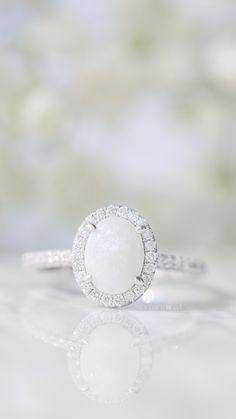 The Evangeline Breastmilk Ring / Keepsake Ring / Breastmilk Jewelry by Milk Couture Co. White Round Cut Halo Ring For Promise Occasion, White Round Cut Halo Ring For Promise, Spiritual Round Promise Rings, Spiritual Diamond Promise Ring, Wedding Jewelry In Diamond White With Si Clarity, Fine Jewelry White Promise Rings, Fine White Jewelry For Promise, Timeless Oval Jewelry With Halo Design, White Halo Setting Ring For Promise