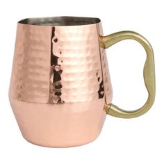 a large metal mug with gold handles